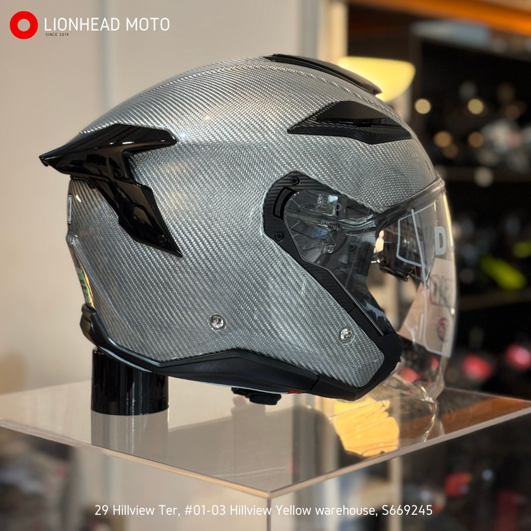 EVO RS10 Silver Carbon helmet, front three-quarter view with the clear visor raised