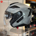 EVO RS10 Silver Carbon helmet, front three-quarter view with the clear visor down