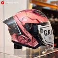Gracshaw Gundam Collectors Zaku Red open face helmet, three-quarter view on a display stand